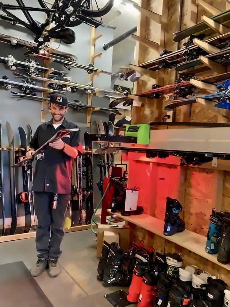 Technician checking over a finished ski before pickup